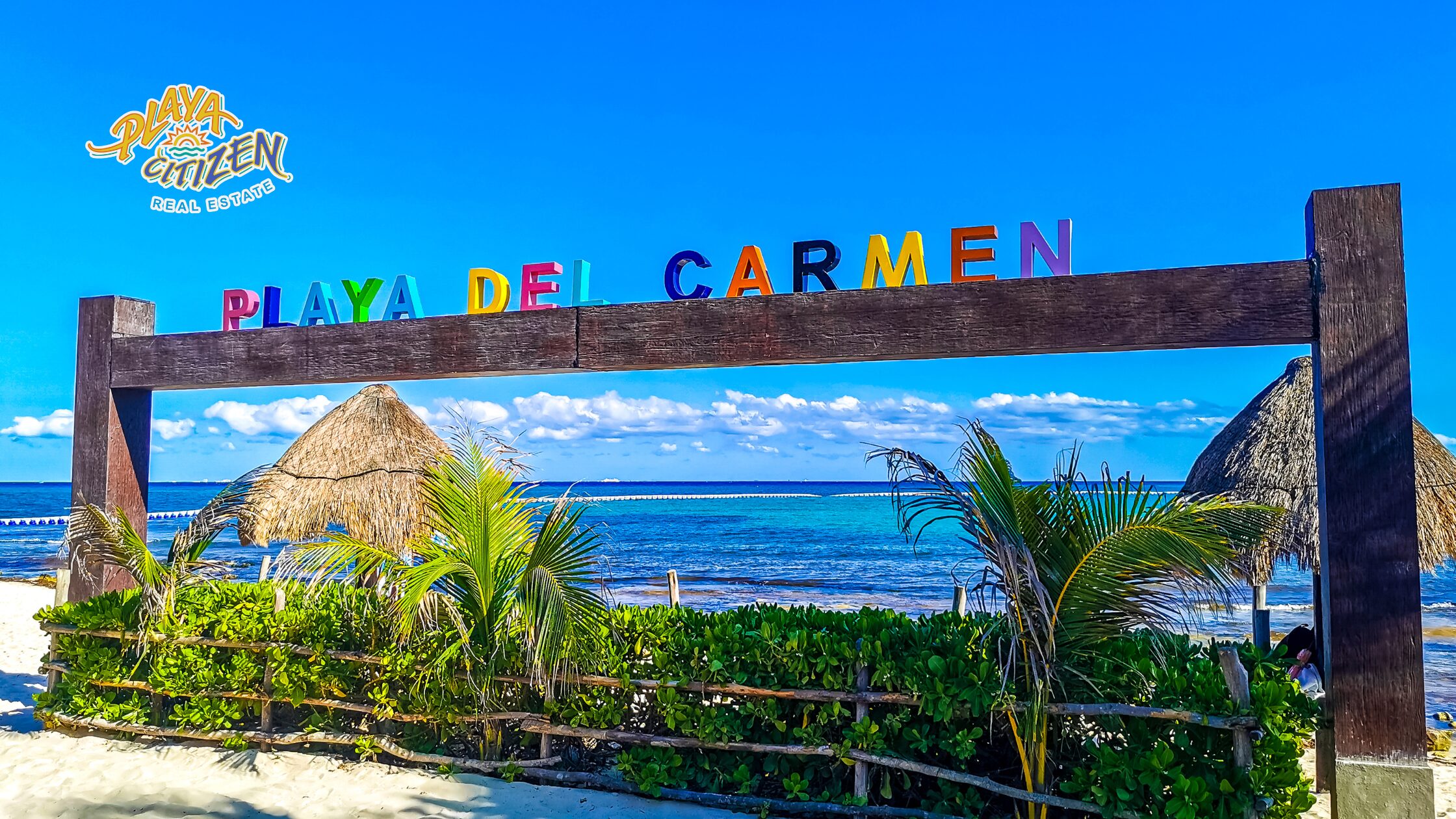 American couple viewing an apartment in Playa del Carmen with a real estate advisor, illustrating how to buy an apartment in Playa del Carmen as an American or Canadian step by step