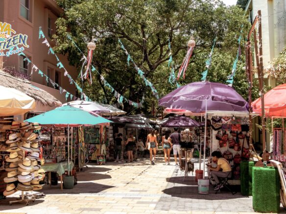 A view of modern apartments in Playa del Carmen at sunset, raising the question of whether it's a good time to invest in real estate in the city.