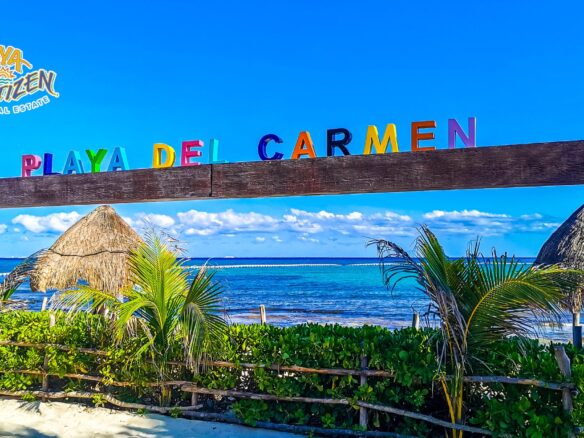 View of condominiums and buildings in Playa del Carmen near the beach, representing the best areas to buy a rental property compatible with Airbnb.