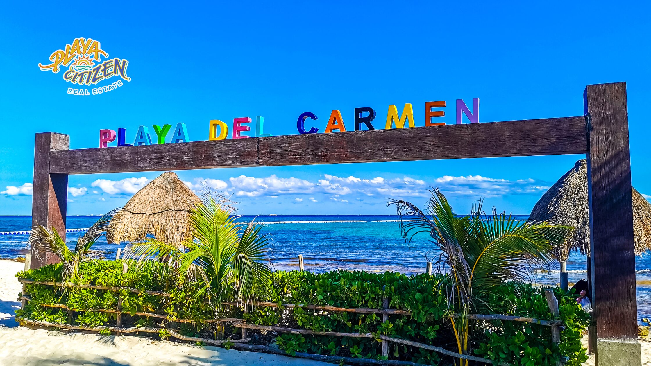 View of condominiums and buildings in Playa del Carmen near the beach, representing the best areas to buy a rental property compatible with Airbnb.