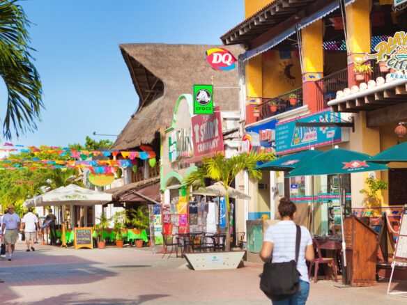 Real estate agent showing properties in Playa del Carmen to a client interested in buying real estate.